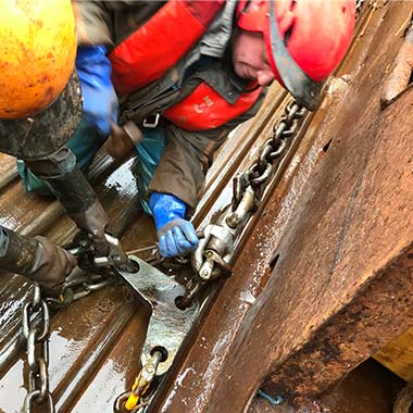 two fishermen working on deck with silverline shackles